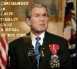 BUSH FINALLY GETS A MEDAL & HIS SPECIAL ASSISTANT