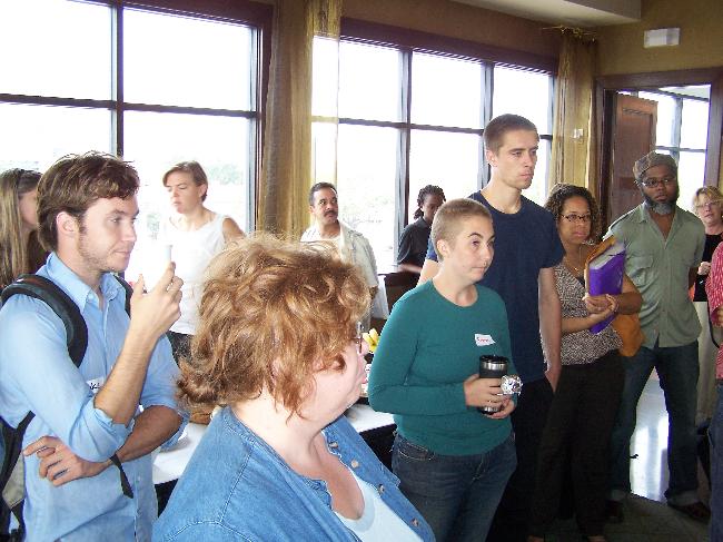 Attendees listen...